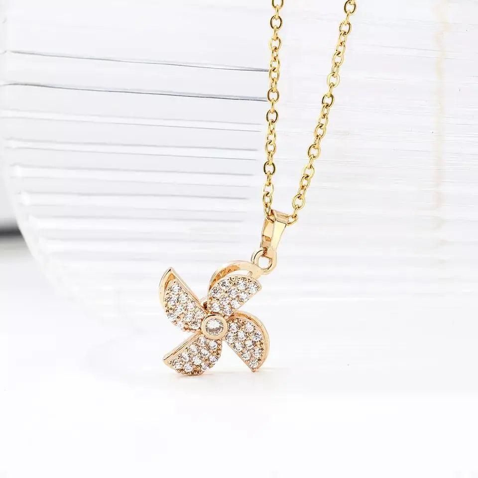 Charming Flower Pinwheel Rotating Necklace – A Whirl of Elegance